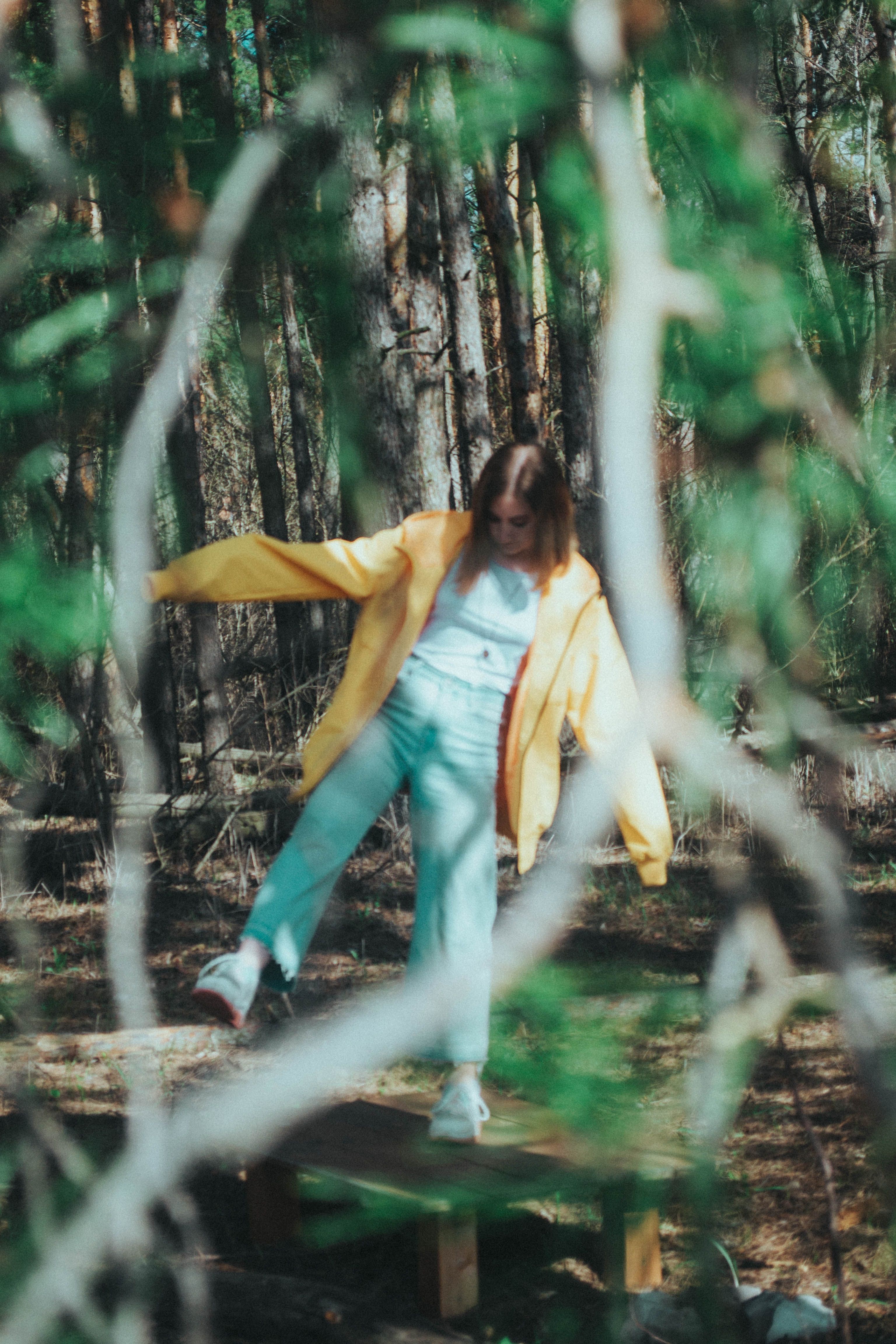 Woman in a Yellow Jacket on a Forest · Free Stock Photo