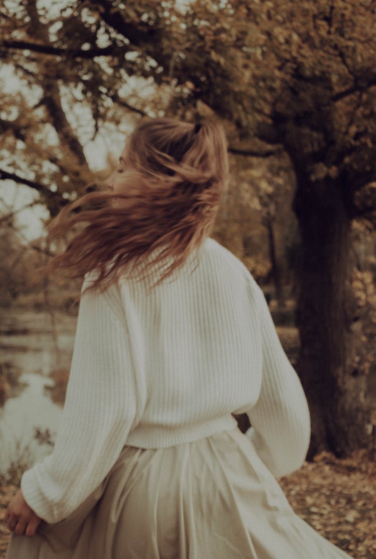 Girl In Sweater And Skirt Running