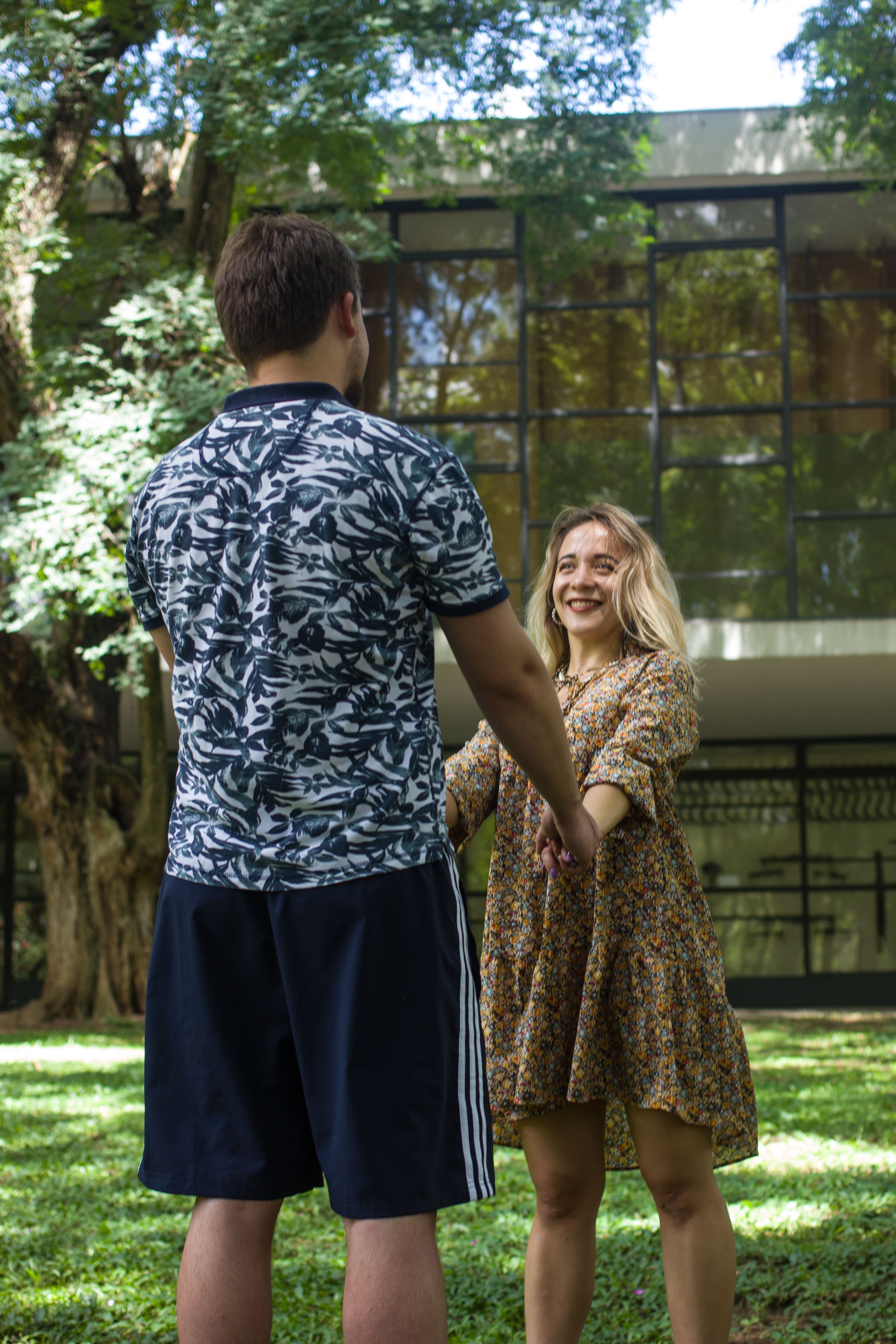A Man and a Woman Standing on Green Grass Field · Free Stock Photo