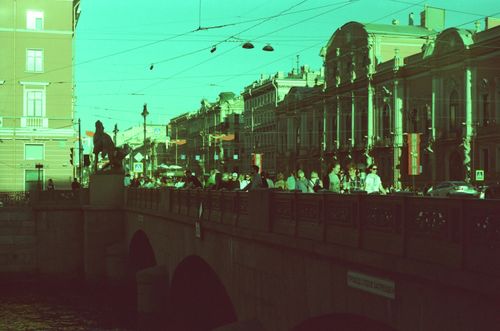 Free A vibrant scene of Saint Petersburg's iconic bridge and bustling city life captured during the day. Stock Photo