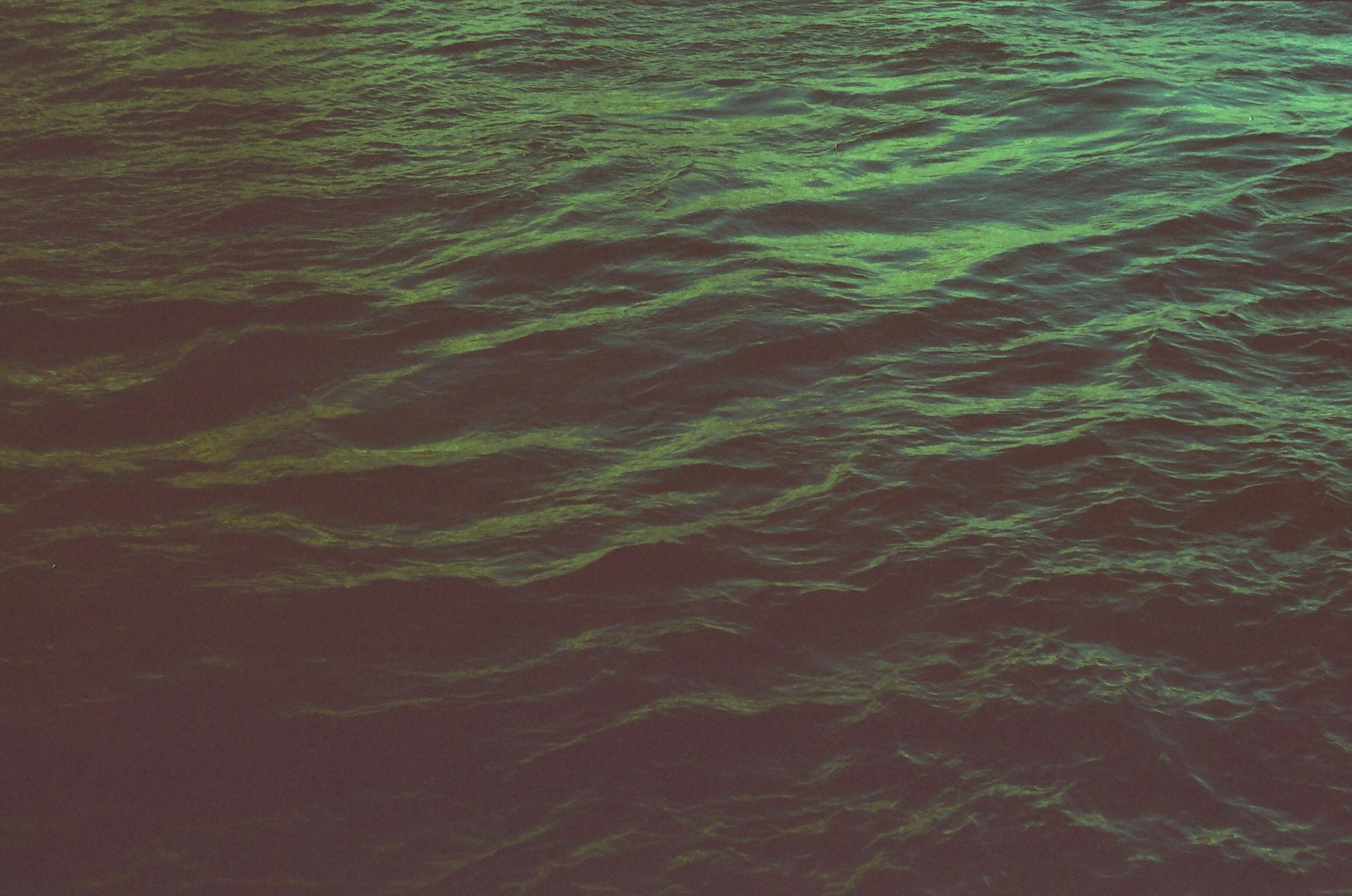Dark and moody ocean waves in St. Petersburg, Russia, captured at night.