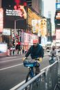 Man in Red Hat Commuting by Bike