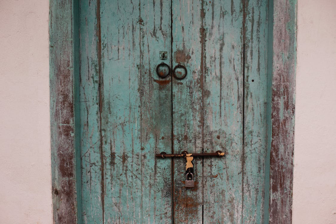 Photo of a Blue Door with a Padlock