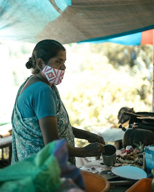 A Female Wearing a Face Mask Standing