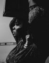 Black and White Picture of Woman Carrying Bag on Head