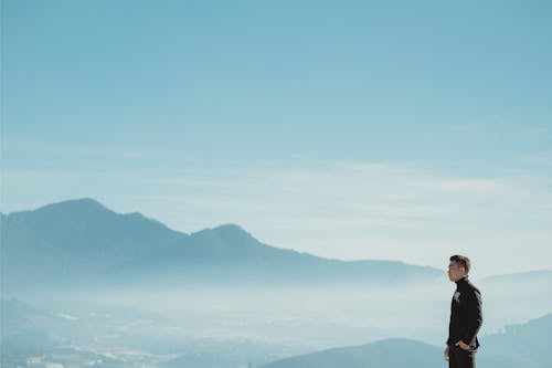 Man Standing on a Mountain Top 