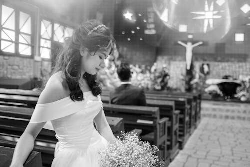 Woman in Wedding Dress in Church