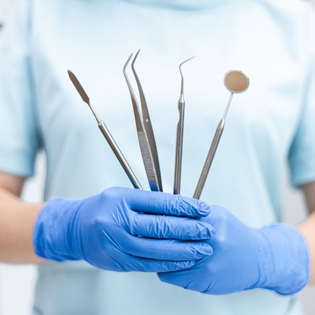 dental hygienist preparing clean sterile instruments