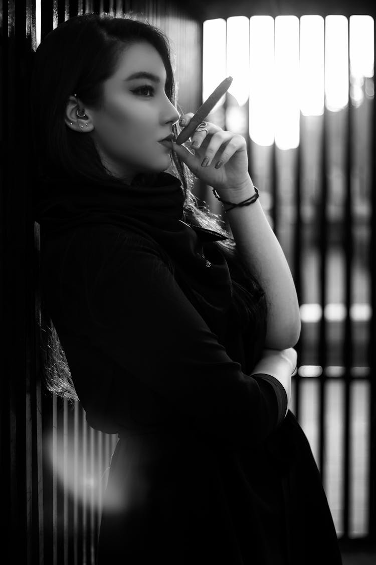 A Woman Smoking A Cigar