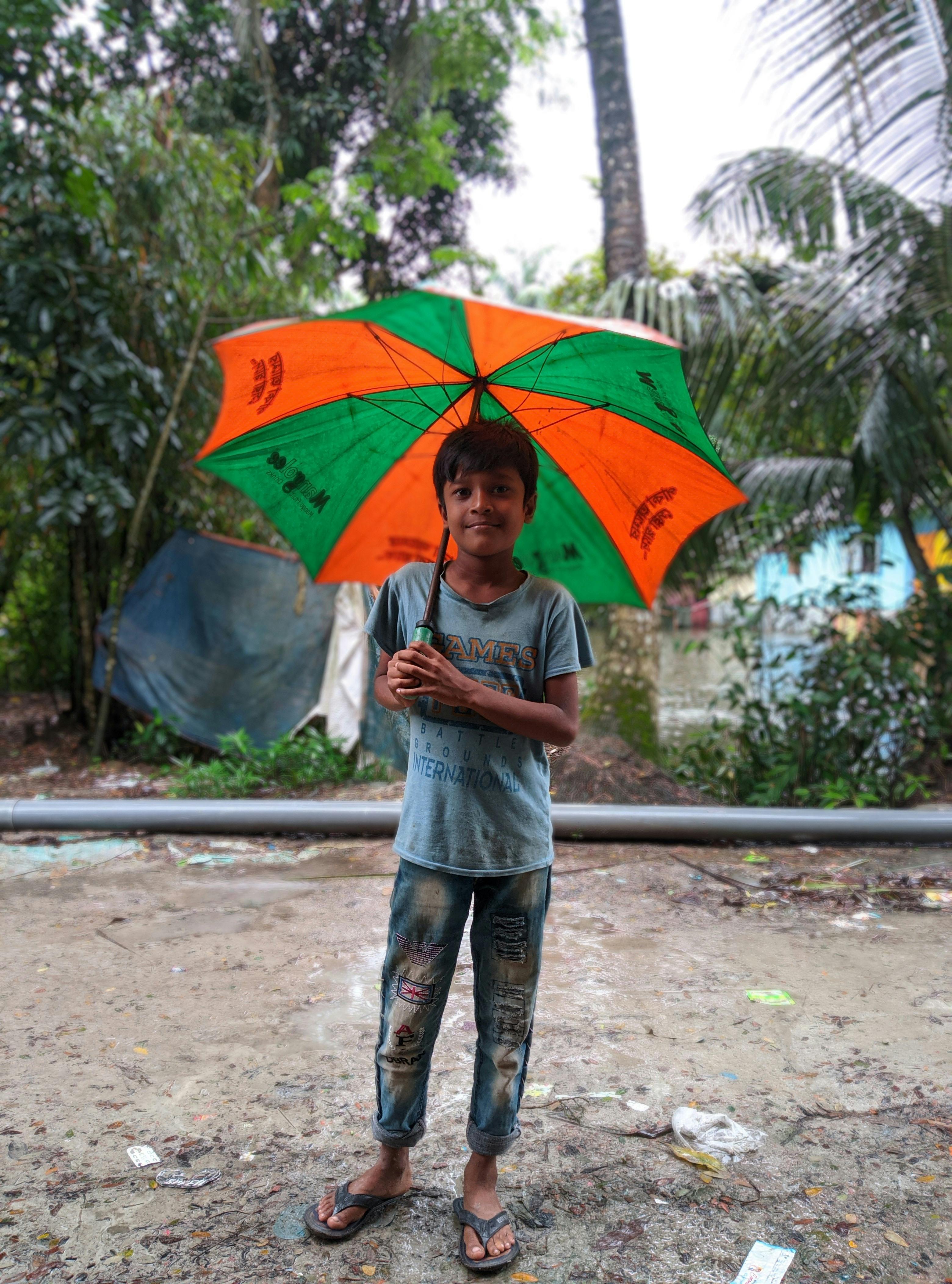 portrait of a boy with an umbrella