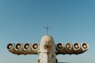 White and Brown Robot Under Blue Sky