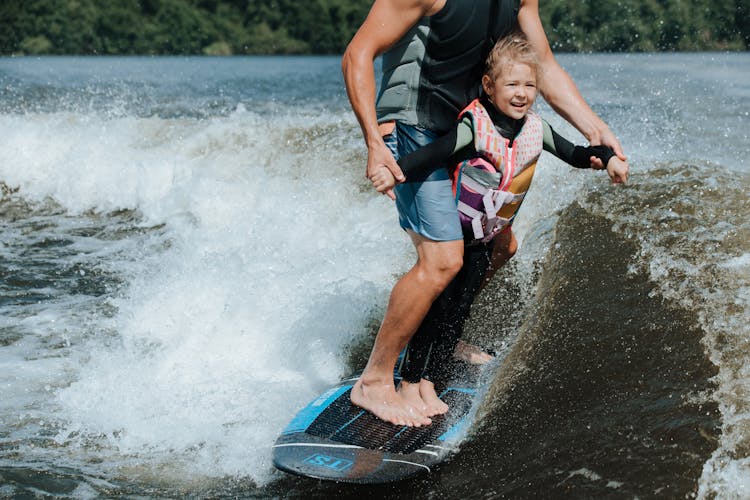 Father And Daughter Wake Surfing