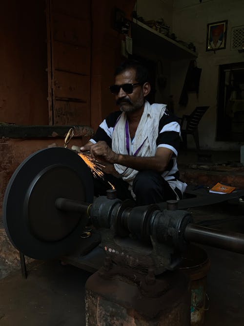 Man Grinding a Metal