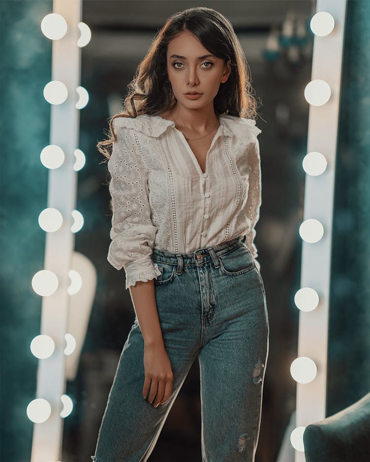 Woman In White Shirt Looking At Camera