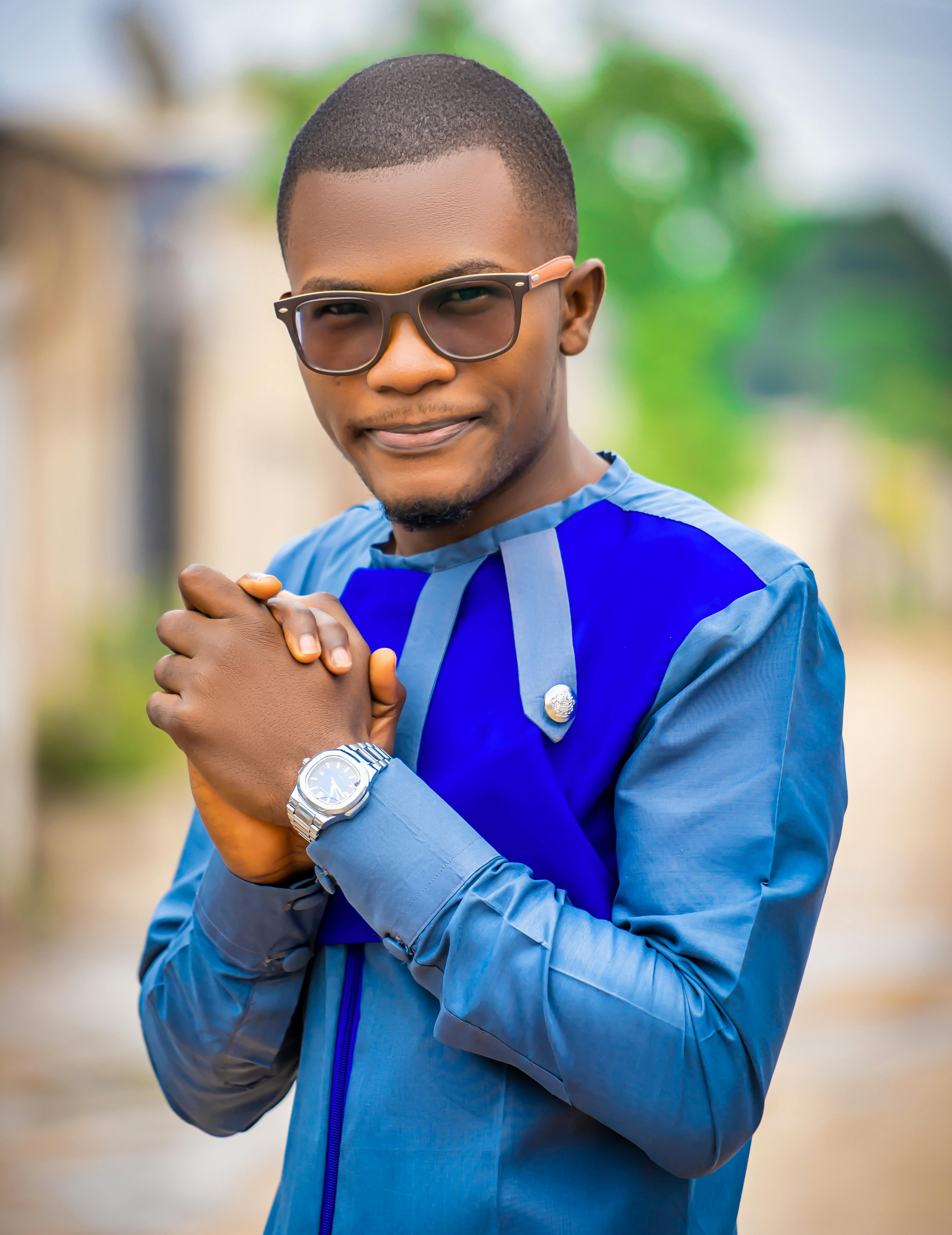 A Man in Blue Jacket Wearing Sunglasses · Free Stock Photo