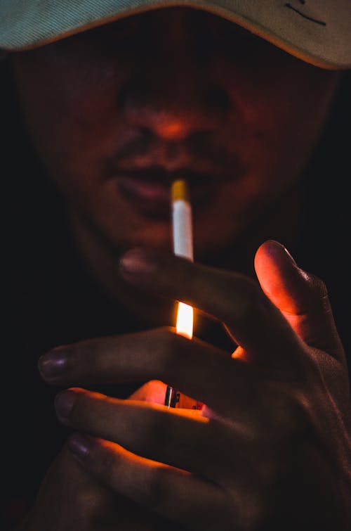 Free Close-Up Shot of Man Lighting a Cigarette Stock Photo