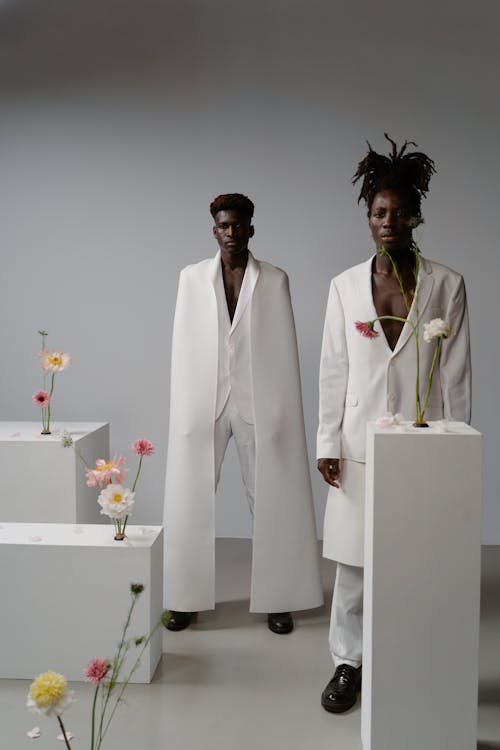 Men Wearing White Suits in a Studio Shoot