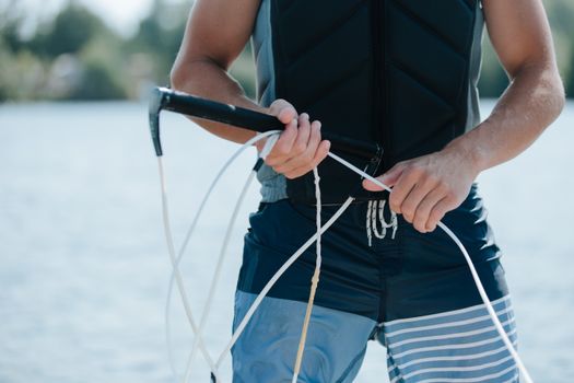 Close up on Man Holding Wakeboarding Winch