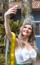 Woman in Crown Taking Selfie