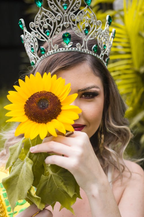 Woman in Crown Holding Sunflower