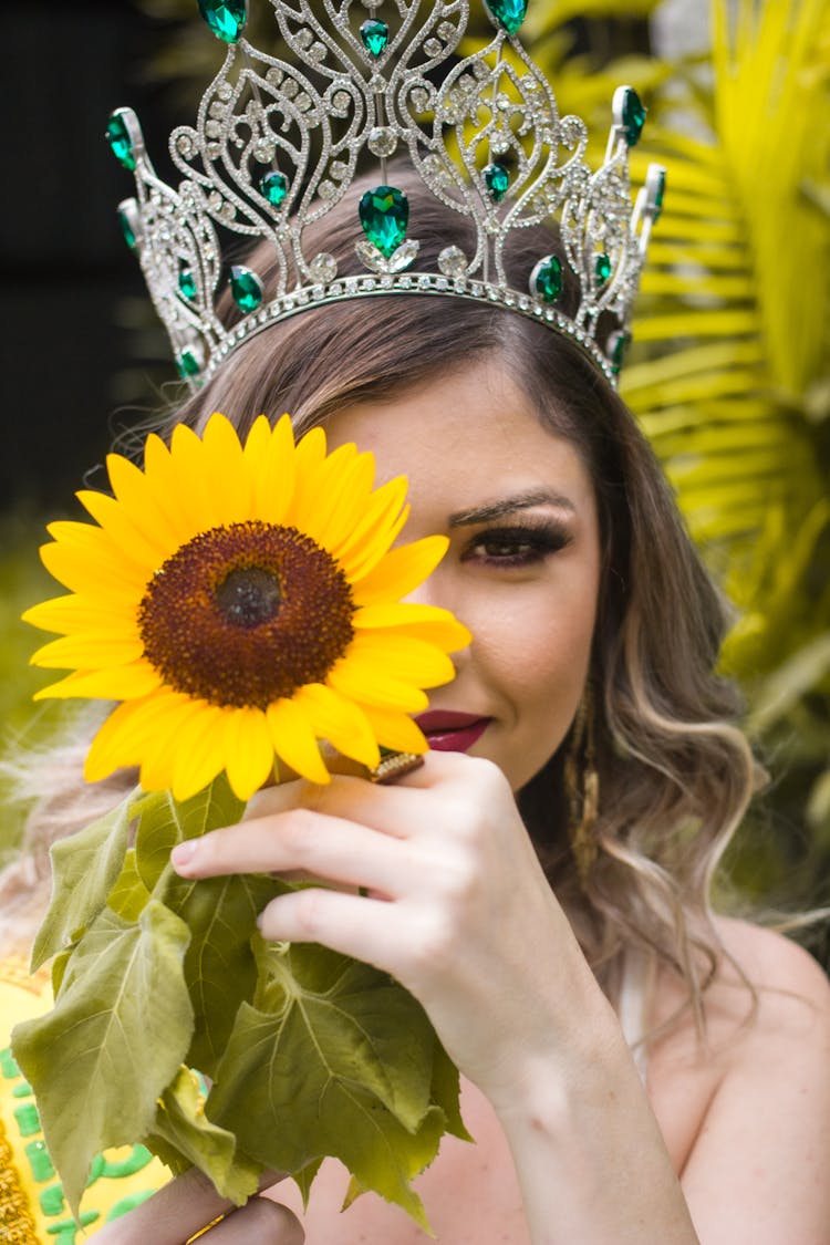 Woman In Crown Holding Sunflower