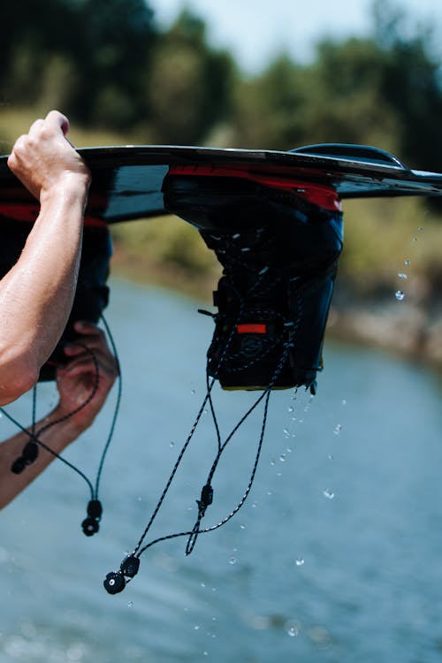 Close up on Wakeboard in Mans Hands