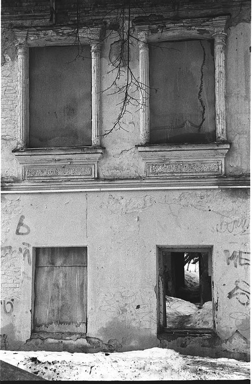 Free Black and white photo of a derelict building facade displaying urban decay. Stock Photo
