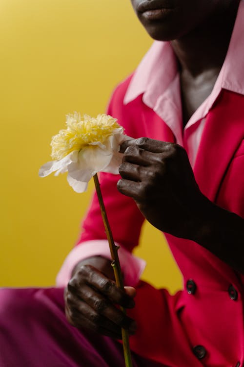 Man Holding a Yellow Flower