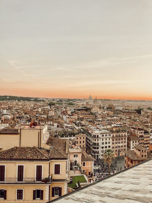 A breathtaking aerial view of Rome's historic cityscape at sunset, showcasing iconic architecture.