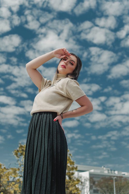 Free A Woman Posing under Cloudy Sky Stock Photo