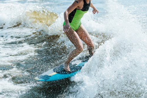 Free A Woman Riding Waves Stock Photo