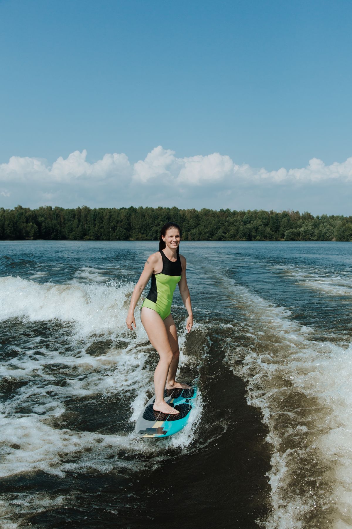 Rider heading into the lake with a wakesurf board