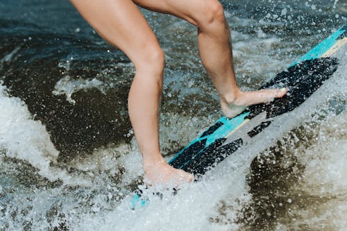 A Surfer Riding Waves