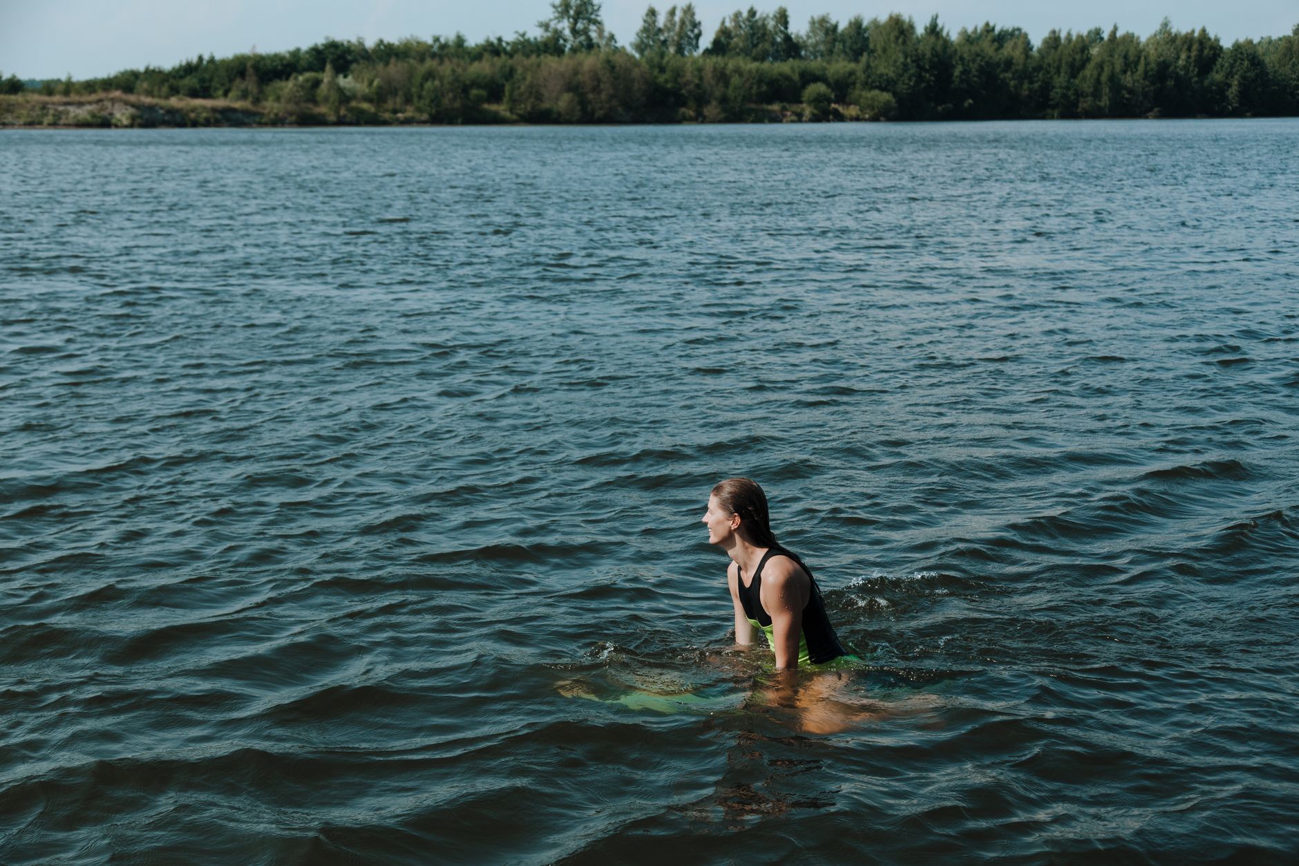 athlete swimming outdoor lake