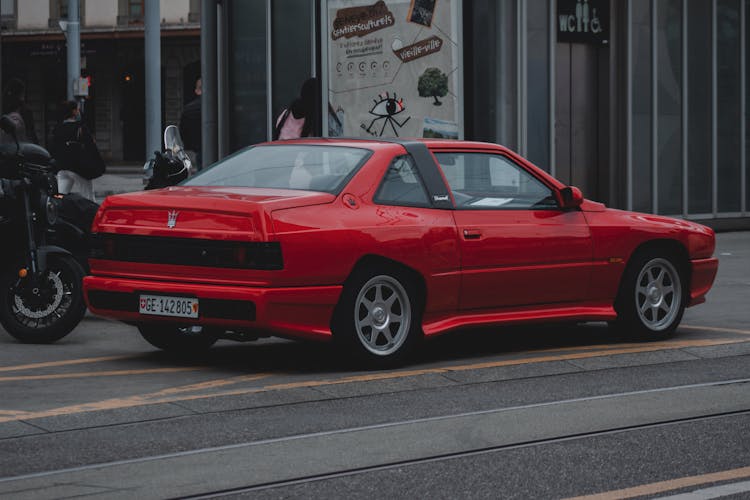 Red Vintage Car Standing On Restricted Parking Place