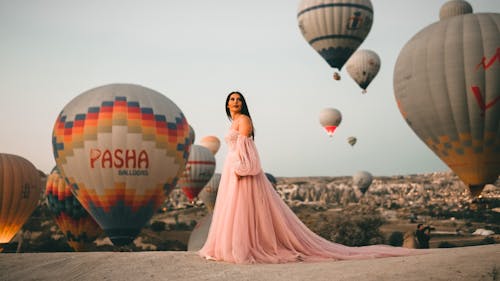 Woman in Front of Hot-Air Balloons