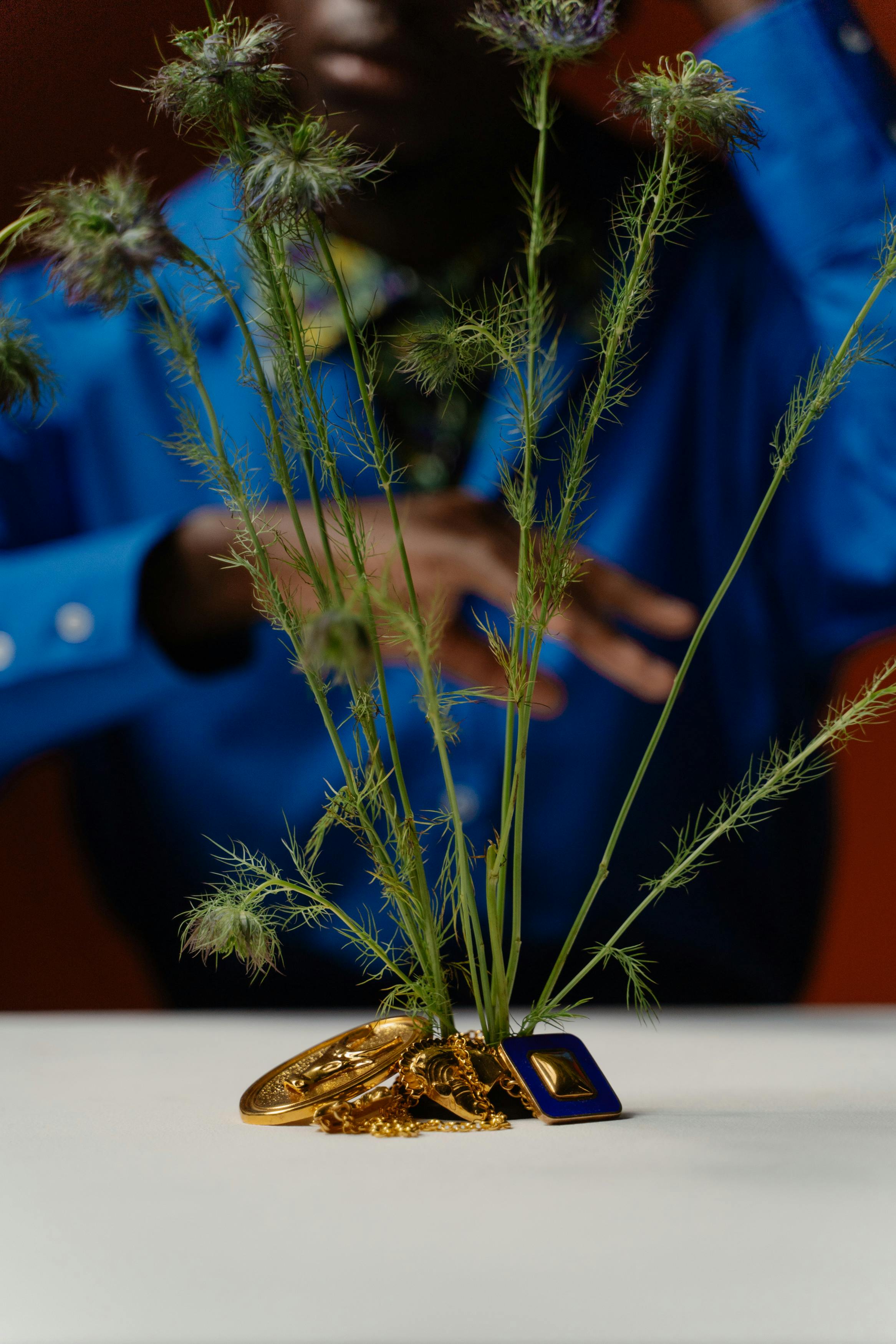 gold accessories around a plant