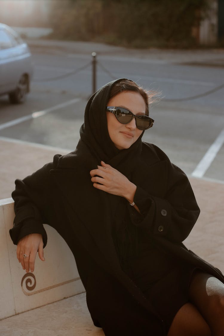 Woman In Black Clothes Sitting On Bench