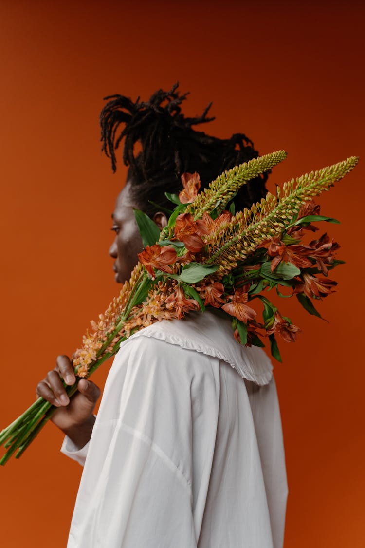 Person Holding Foxtail Lily On Shoulder