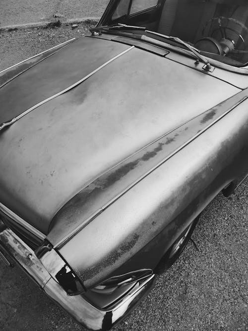 Grayscale Photo of a Car Hood