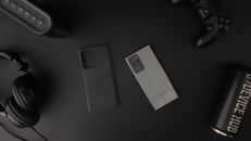 Phone and Other Devices on Black Table