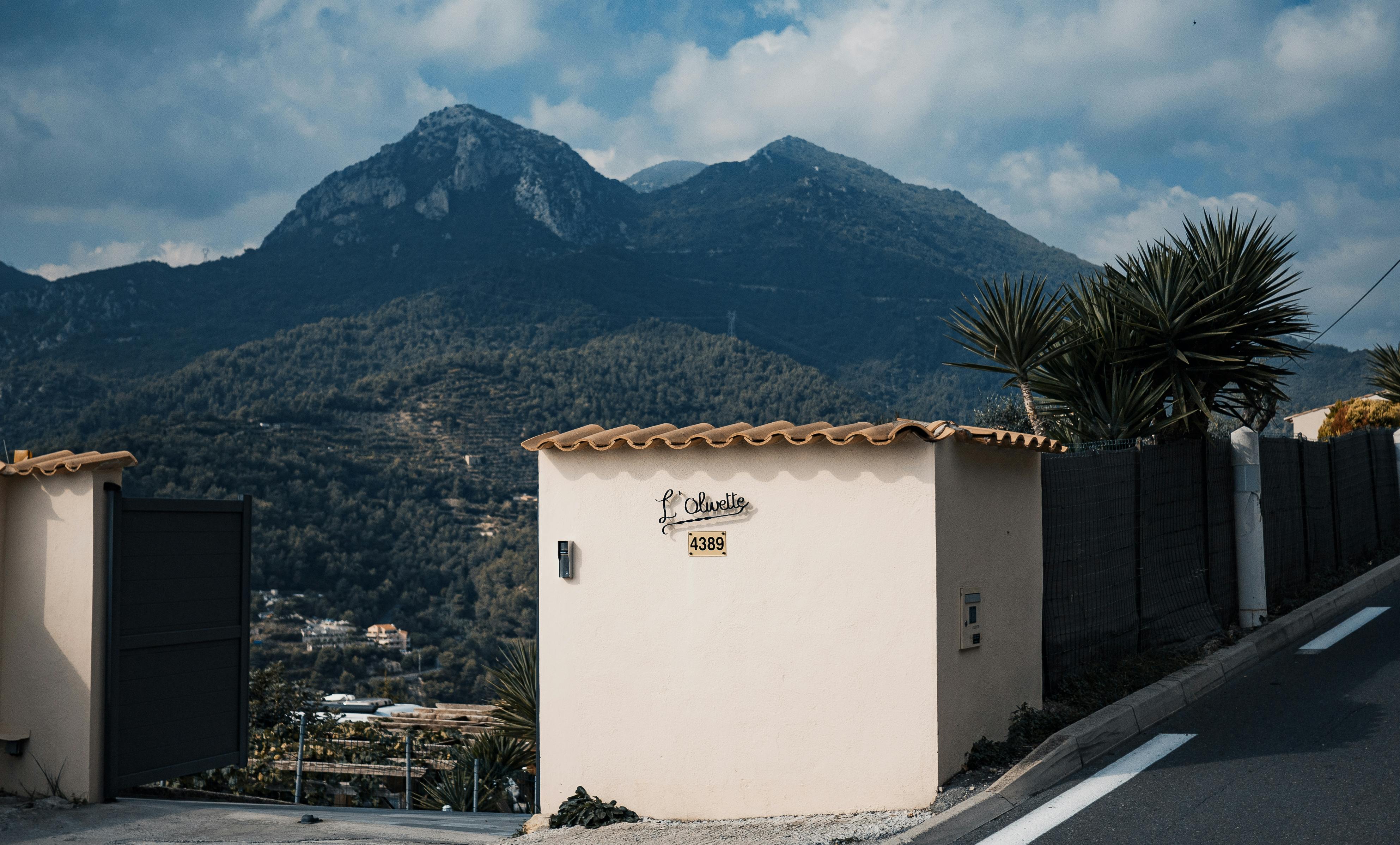 Mountainside entrance in Menton, Provence-Alpes-Côte d'Azur with a scenic mountain backdrop.