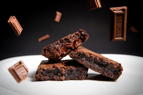 Brown Chocolate Bar on White Ceramic Plate