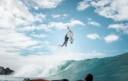 Man with a Surfboard Midair 