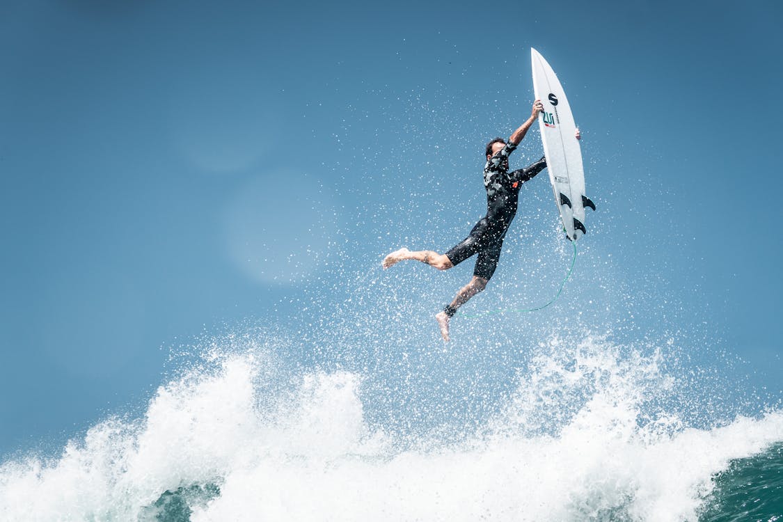 Free Surfer Falling on Wave Stock Photo