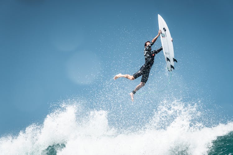 Surfer Falling On Wave