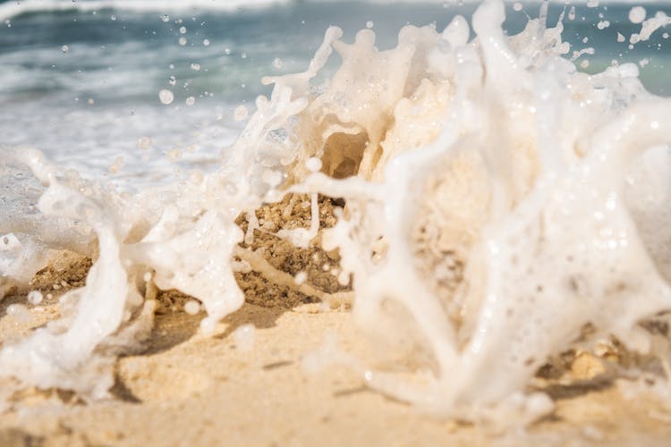 Wave Crashing On Sand