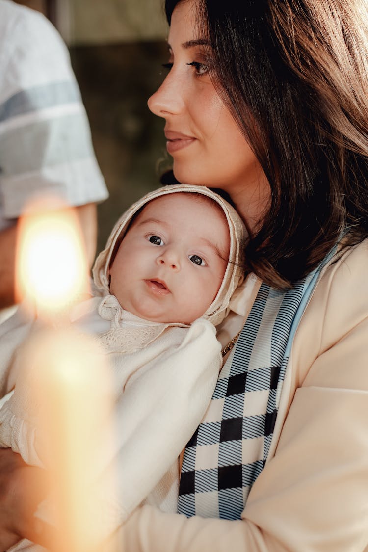 Mother And Little Baby At Christening Ceremony