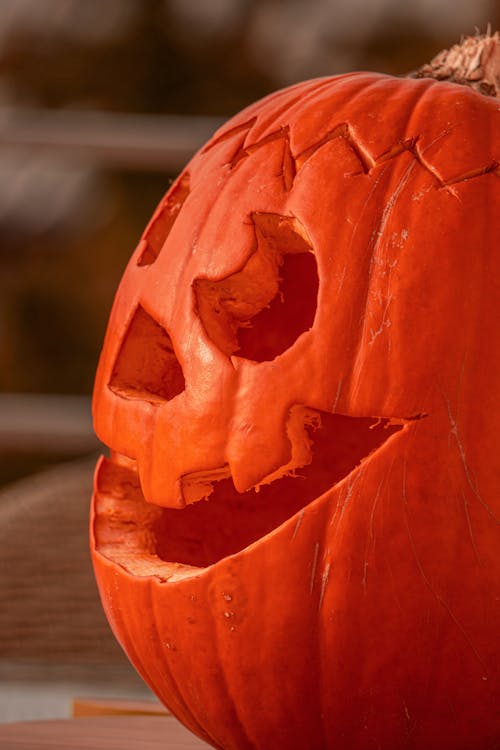 Close-Up Photograph of a Carved Pumpkin