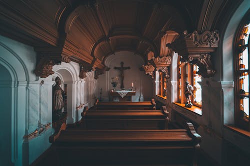 Brown Wooden Benches Inside the Church
